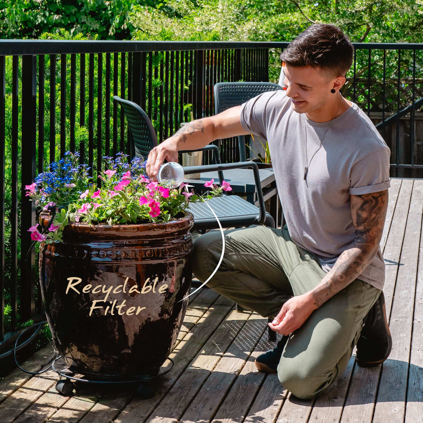 A man opening his recyclable Santevia MINA Alkaline Pitcher filter and composting the minerals#colour_black