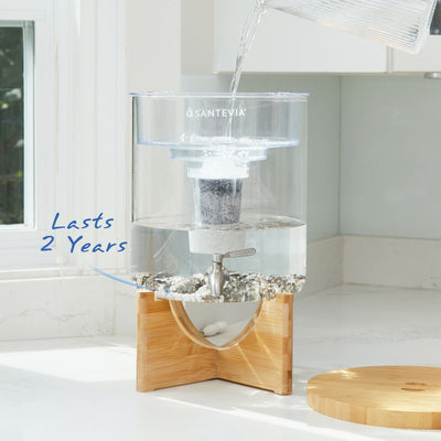 Santevia Glass Water System in a bright white sunny kitchen. Santevia Mineral Stones last for 2 years